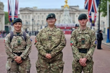Standing at attention in front of Buckingham Palace