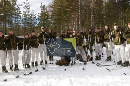 Norway cadets in snow holding ACCT UK flag