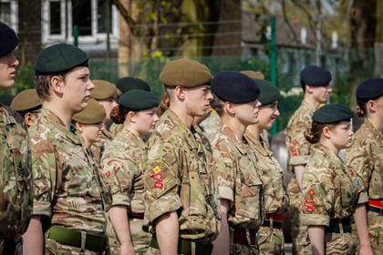 cadets stood at attention in a group facing forward