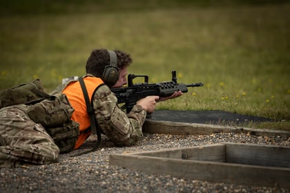 Senior Cadet lies on the ground with weapon at range