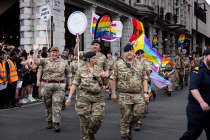 Adult volunteers from the Army Cadets walk in the parade in London