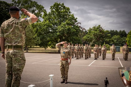 Senior cadet salutes senior officer on parade ground