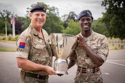 Senior Officer presents ACF winner his trophy