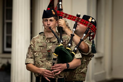 Cadet playing bagpipes during rehearsal