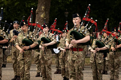 Adult volunteers and cadets playing bagpipes