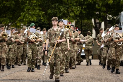 Cadets playing instruments and marching during rehearsals