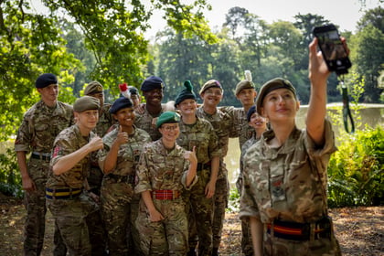 Cadets from the Master Cadet course take a selfie by the lake
