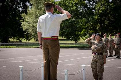 CO from Frimley saluting the female cadet leader of the parade