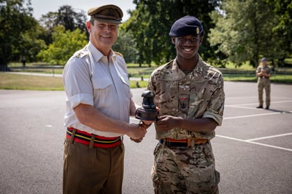 CO from Frimley Park hands over trophy to male cadet for winning top student