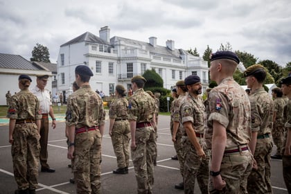 Senior officers talk to the Master Cadets as they stand on the parade square
