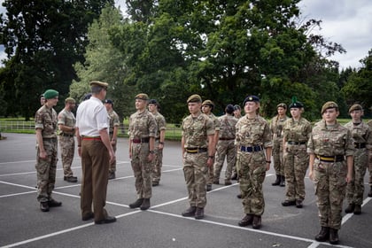 Cadets stand to attention while the CO from Frimley Park CTC talks to them