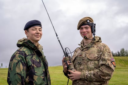 Cadets holding a radio doing CIS exercises
