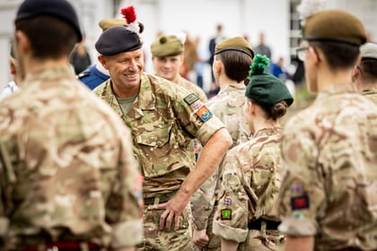 Senior instructor jokes with some cadets on final parade
