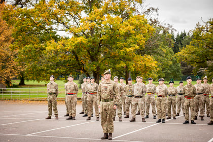 Master cadets stand at attention
