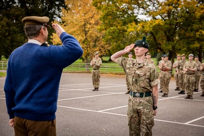 Top student salutes senior commander in blue sweater