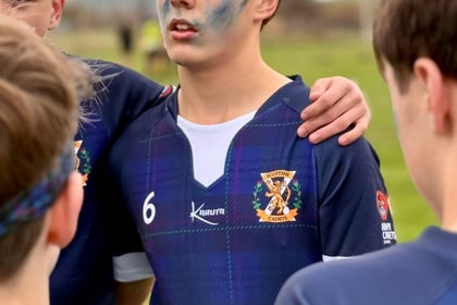 Male cadet in huddle at National Rugby Competition