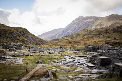 Views of Snowdon Mountain range with walkers in the distance