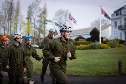 Cadets run during log run on the Master Cadet course
