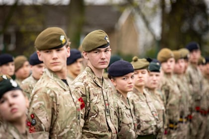 Cadets with their heads turned standing in a straight line