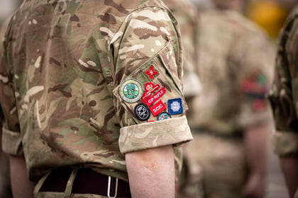 Various badges on the sleeve of a cadet uniform