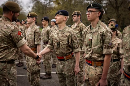 Instructor shakes hands with Master Cadet Course Final Parade