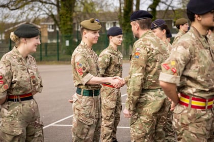 Cadet shakes hand with CO of Frimley Park CTC