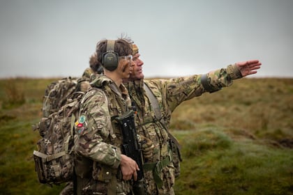 Adult instructor gives directions to male cadet during fieldcraft exercise at Cadet Cambrian Patrol 2026