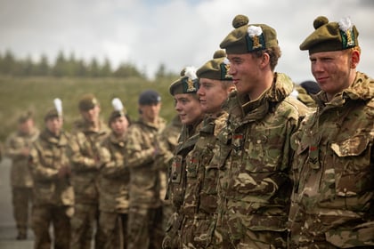 A group of cadets from Scotland stand in a row
