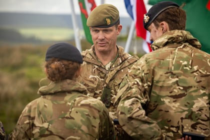 Adult instructor giving out medals