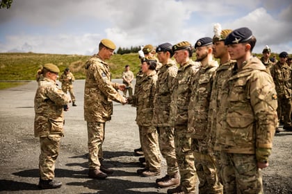 Cadet team receives a medal from an adult instructor at Cadet Cambrian Patrol 2026