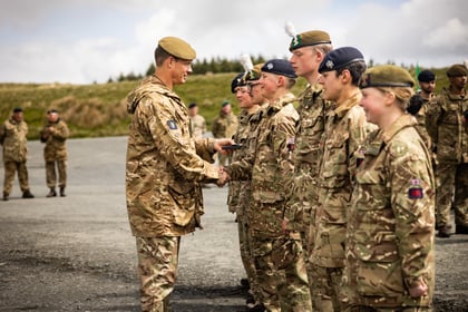 Cadets receives a medal from an adult instructor at Cadet Cambrian Patrol 2026