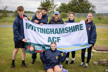 Cadets from Nottinghamshire ACF stand with their team banner