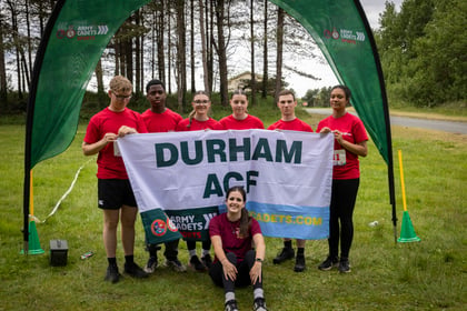 Cadets from Durham ACF hold up a team banner