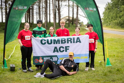 Team from Cumbria ACF with their team banner