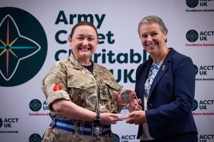 Sally Orange presents an award to an adult volunteer