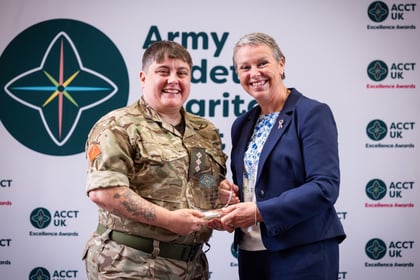 Sally Orange presents an award to an adult volunteer at the ACCT UK Awards