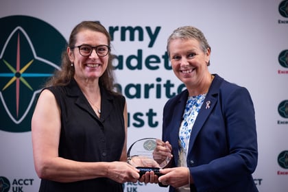 Sally Orange presents an award to an adult volunteer at the ACCT UK Awards