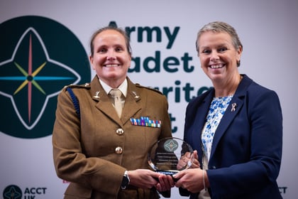 Sally Orange presents an award to an adult volunteer at the ACCT UK Awards