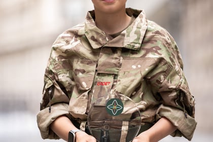 Young male cadet holds his ACCT UK Award