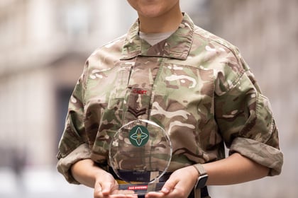 Female cadet holds her ACCT UK Award