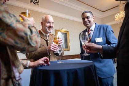 People launching while attending a coffee reception