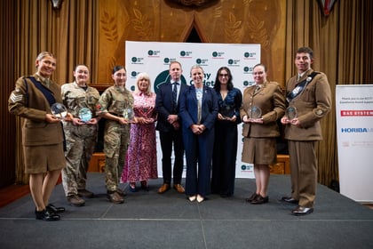 Group of award winners at ACCT UK Awards stand with host and corporate sponsor