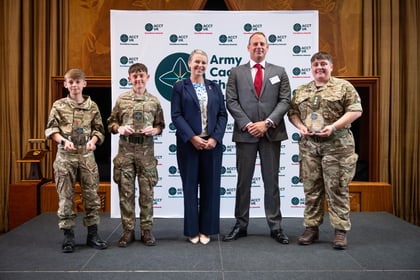 Group of award winners at ACCT UK Awards stand with host and corporate sponsor