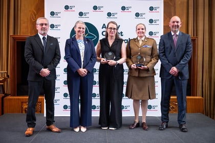 Group of award winners at ACCT UK Awards stand with host and corporate sponsors