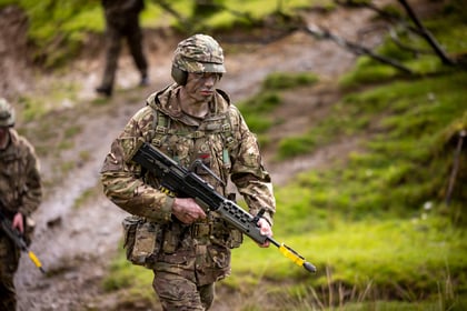 Male cadet wears uniform with weapon during fieldcraft exercise at Cadet Cambrian Patrol 2026