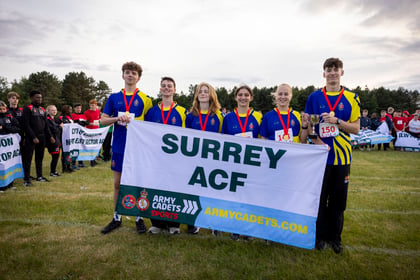 Rivalry Cup winners Surrey ACF hold up banner with their county name