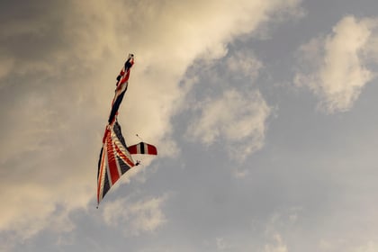 Army Red Devils doing a parachute jump with the Union Jack flag
