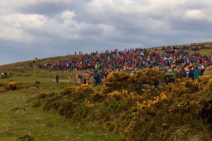 Participants of Ten Tors stand on a hill waiting for the start of the challenge
