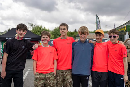 Young cadets with brightly coloured tops stand in a group