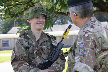 smiling cadet talking to the comdt